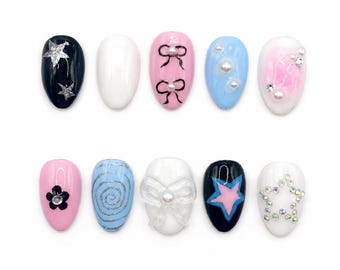 Coquette pastel à presser sur les ongles | Ensemble d'ongles courts ovales roses et bleus en perles d'étoiles