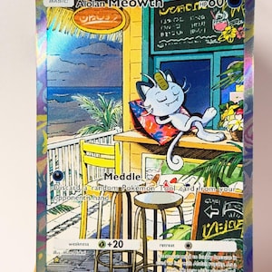 May include: A holographic Alolan Meowth Pokémon trading card. The card features an illustration of a relaxed Meowth on a tropical deck. The card has text that reads "Alolan Meowth", "HP60", and other game-related text.