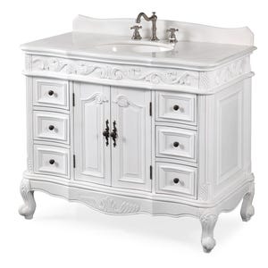 May include: White bathroom vanity with a marble countertop, oval sink, and ornate detailing. Features two cabinet doors, six drawers, and decorative hardware. The vanity has curved legs and a classic design.