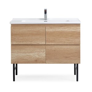 May include: A light wood bathroom vanity with four drawers and black metal legs. The vanity has a white ceramic countertop with a single faucet.