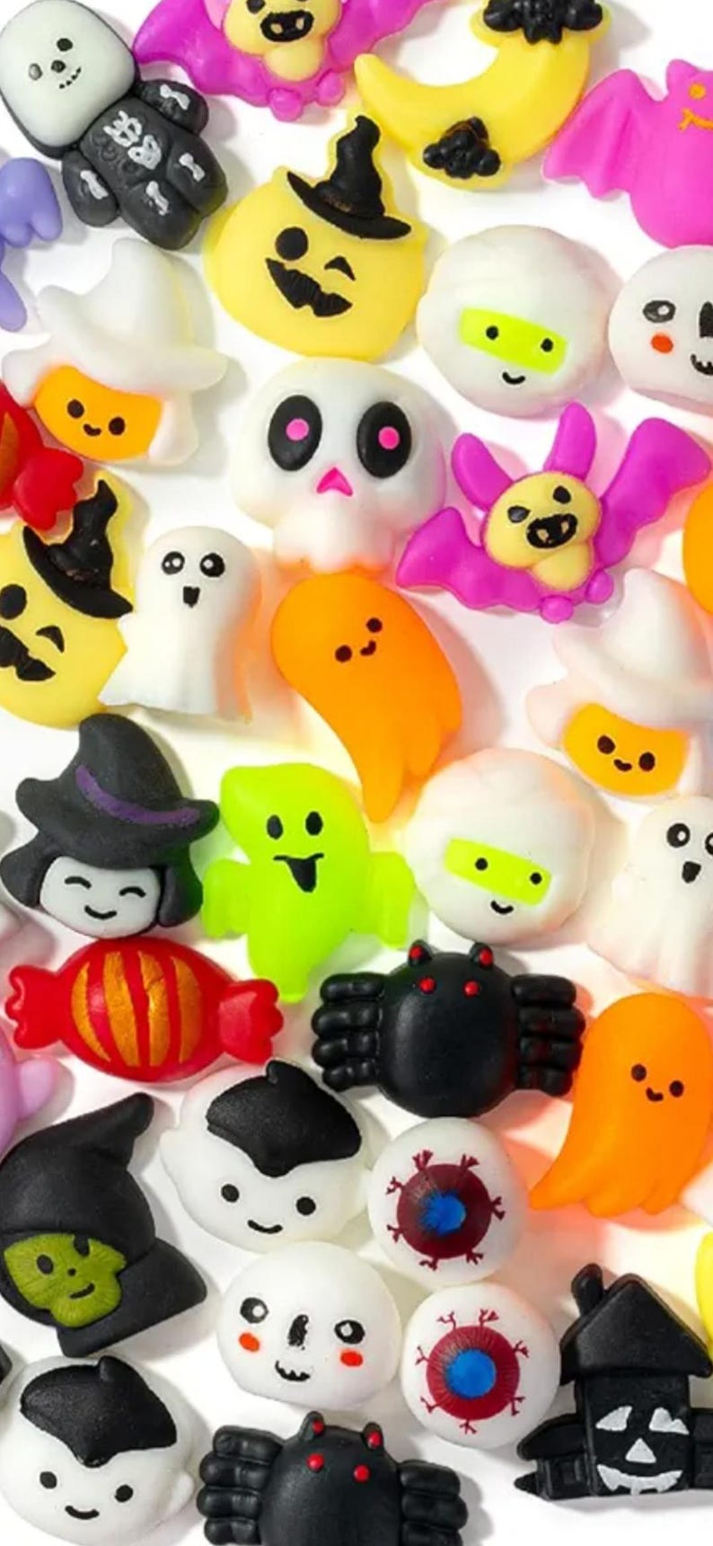 May include: A collection of small, colorful Halloween-themed resin cabochons featuring various shapes including ghosts, skulls, pumpkins, bats, spiders, eyeballs, candy, and haunted houses in vibrant shades of orange, black, white, green, and purple.