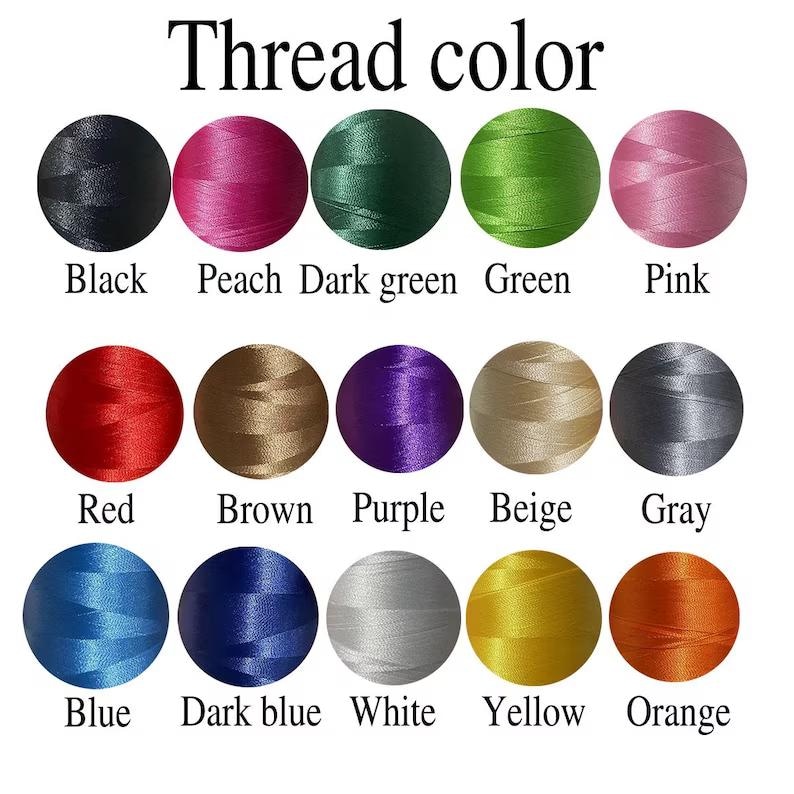 May include: A color chart titled Thread color featuring fifteen circular swatches of embroidery thread in black, peach, dark green, green, pink, red, brown, purple, beige, gray, blue, dark blue, white, yellow, and orange with labels below each.