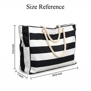 May include: A black and white striped tote bag with thick cream-colored rope handles and side pockets. The bag features dimensions of 14.5 inches in height, 20.8 inches in width, and 7 inches in depth as indicated by the size reference text.