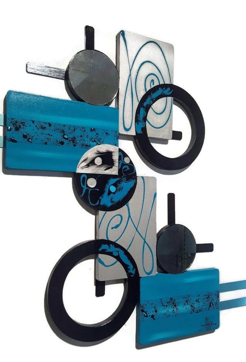 May include: Abstract wall art featuring geometric shapes in black, silver, and turquoise blue. The piece includes circles, squares, and rectangles with a modern design.