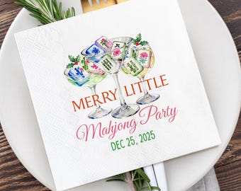 May include: White paper napkin with a watercolor illustration of three martini glasses filled with mahjong tiles. The text "MERRY LITTLE Mahjong Party DEC 25, 2025" is printed on the napkin in red and green.