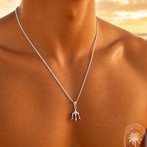 May include: A silver-toned metal necklace featuring a small trident pendant suspended from a delicate curb chain. The pendant is shaped like a three-pronged spearhead. A circular logo in the bottom right corner reads Azure Jewels Estd 2024.