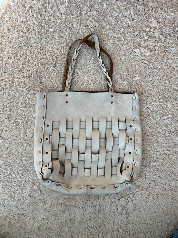 white woven leather tote bag with braided straps
