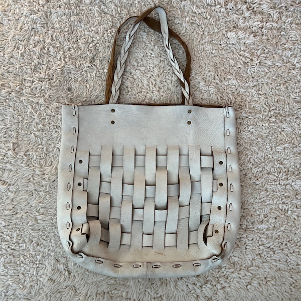 white woven leather tote bag with braided straps