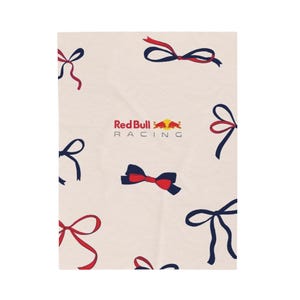 May include: A cream-colored background with a red bull logo and the text "Red Bull Racing". The background is decorated with blue and red bows.