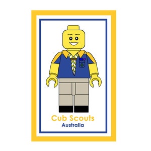 May include: A yellow Lego figure wearing a blue uniform with a yellow and green scarf and a badge. The figure is standing in a yellow frame with the text "Cub Scouts Australia".