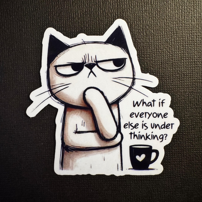May include: A white cat sticker with black ears and a grumpy expression, pondering with its paw on its chin. The sticker includes the text "What if everyone else is under thinking?" and a coffee cup with a heart.