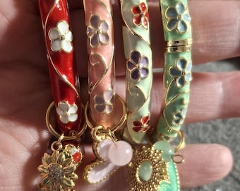 rigid spring bangle bracelet with colorful enamel and small flower motif, stainless steel charms and beads - gift
