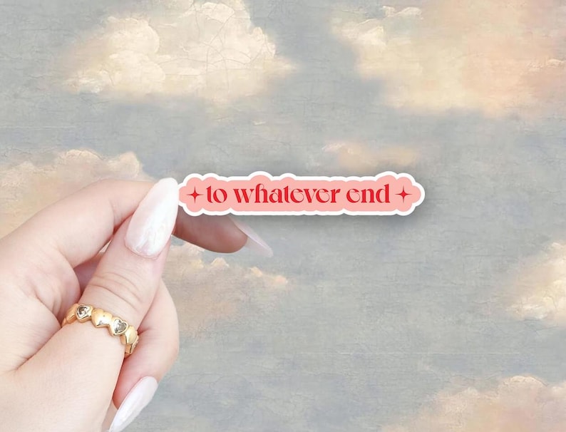 May include: Pink sticker with a white border and a red star on each side. The sticker says "to whatever end" in a red, stylized font.