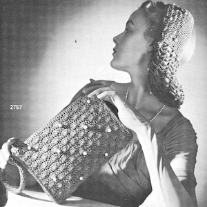 May include: A black and white photo of a woman wearing a crocheted hat and holding a crocheted bag with pearl beads. The bag has a textured design and a long strap.
