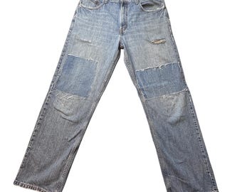 Jeansy Levi's 569 Vintage Mens 34x34 (35x31) Niebieskie, luźne, z przetarciami i łatkami