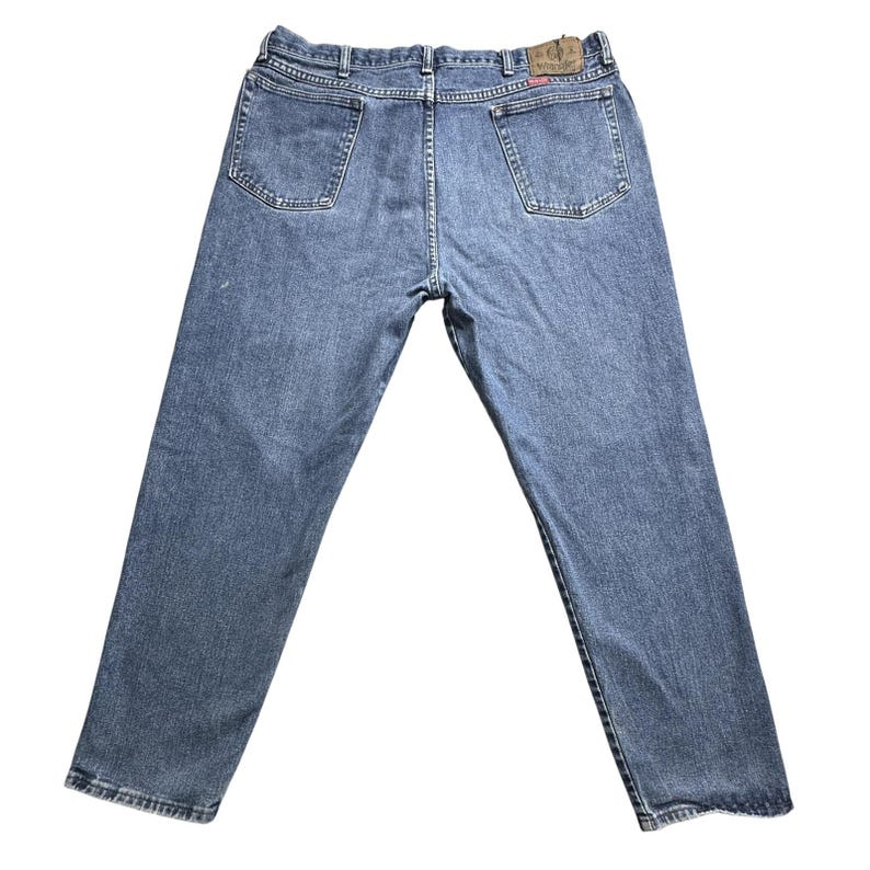 Jeans Wrangler vintage para hombre, talla 39x27.5, denim azul, tiro alto, desgastados, rotos, auténticos. imagen 1
