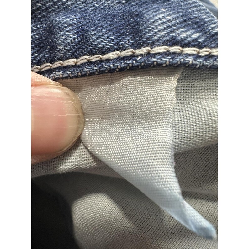 Jeans Wrangler vintage para hombre, talla 39x27.5, denim azul, tiro alto, desgastados, rotos, auténticos. imagen 3