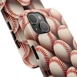 May include: A white iPhone case with a baseball pattern. The case has a camera lens cutout and a white background.