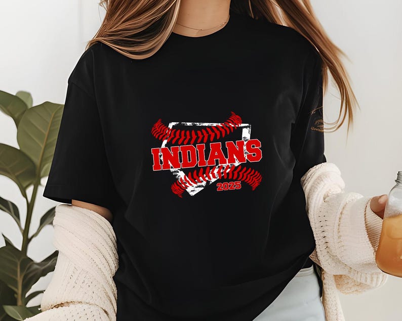 May include: Black t-shirt with a red and white baseball graphic. The graphic features the word "INDIANS" and the year "2023".
