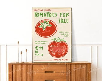 May include: A framed print featuring a vintage-style advertisement for tomatoes. The poster has a beige background with red and green text and illustrations. The text reads "Tomatoes for Sale" and "Farmers Market". The price is listed as $2.99 per pound.
