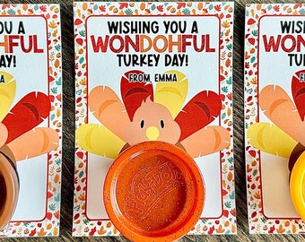 May include: Three cards with a turkey design and the text "Wishing you a Wondohful Turkey Day! From Emma." Each card has a Play-Doh container in brown, orange, and yellow.