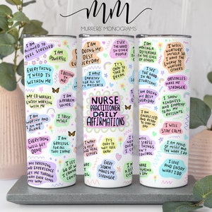 May include: Four white tumblers with colorful motivational quotes for nurse practitioners. The quotes include "I am allowed to feel stressed", "I am doing my best everyday", "I see the good in all situations", and "I will nurture myself so I have the energy to nurture others".