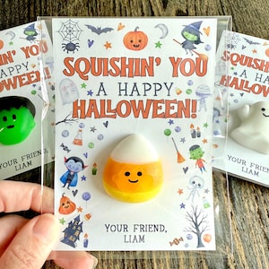 May include: Halloween-themed gift cards with a candy corn-shaped stress ball, a green Frankenstein stress ball, and a white ghost stress ball. The cards read "Squishin' You a Happy Halloween!" and are decorated with Halloween icons.