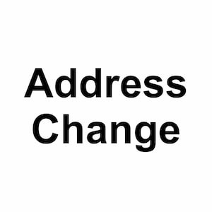 May include: Black and white text that reads "Address Change" in bold, sans-serif font.