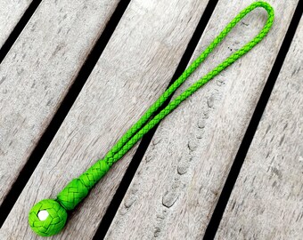 May include: Bright green braided lanyard with a matching spherical knot and a small silver accent. The lanyard is made of a durable, woven material and features a loop at the top for easy carrying. The design is simple and modern.