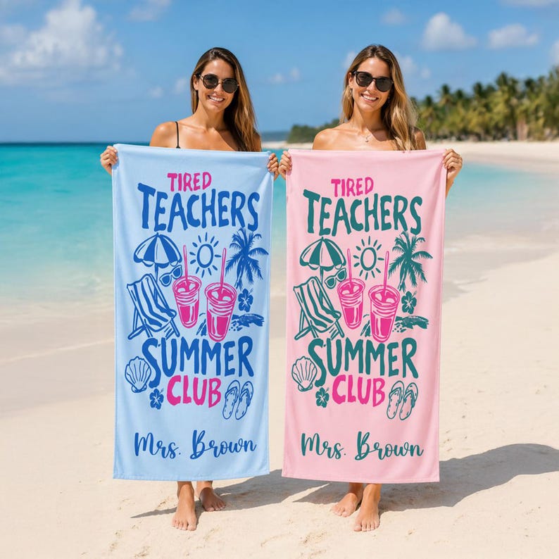 May include: Two beach towels, one light blue and one pink, are displayed on a sandy beach. Each towel features the text "Tired Teachers Summer Club" with beach-themed illustrations and the name "Mrs. Brown".