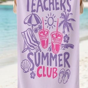 May include: A lilac beach towel with the text "Tired Teachers Summer Club" in purple and pink. The towel has illustrations of beach-themed items, including a parasol, sunglasses, a deckchair, drinks, and Mrs. Brown's name.