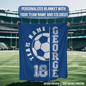 May include: A blue personalized blanket with a soccer ball graphic and the text "TEAM NAME" and "GEORGE 18". The blanket is displayed on a football field. The text "PERSONALIZED BLANKET WITH YOUR TEAM NAME AND COLORS!!!" is at the top.