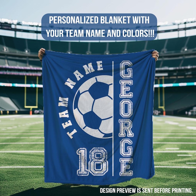 May include: A blue personalized blanket with a soccer ball graphic and the text "TEAM NAME" and "GEORGE 18". The blanket is displayed on a football field. The text "PERSONALIZED BLANKET WITH YOUR TEAM NAME AND COLORS!!!" is at the top.
