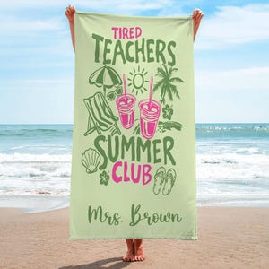 May include: A pale green beach towel with the text "Tired Teachers Summer Club" in green and pink. The towel has illustrations of a beach umbrella, sunglasses, a beach chair, drinks, a seashell, a flower, a palm tree, and flip-flops. The name "Mrs. Brown" is printed at the bottom.