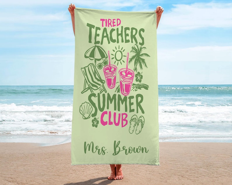 May include: A pale green beach towel with the text "Tired Teachers Summer Club" in green and pink. The towel has illustrations of a beach umbrella, sunglasses, a beach chair, drinks, a seashell, a flower, a palm tree, and flip-flops. The name "Mrs. Brown" is printed at the bottom.