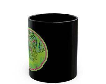 May include: A black ceramic mug featuring a circular graphic on its side. The design displays a bright lime green background with a hot pink border, containing a detailed illustration of numerous small mushrooms and a stylized green creature face.