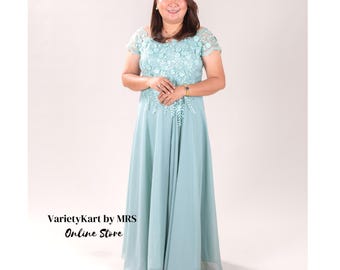 May include: A light blue maxi dress with a lace bodice and short sleeves. The dress has a flowing skirt and is perfect for a special occasion.