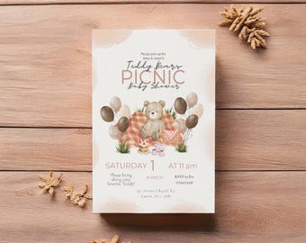 May include: A baby shower invitation with a watercolor illustration of a teddy bear sitting on a picnic blanket with balloons and a cake. The text reads "Teddy Bears Picnic Baby Shower" and includes the date, time, and RSVP information.