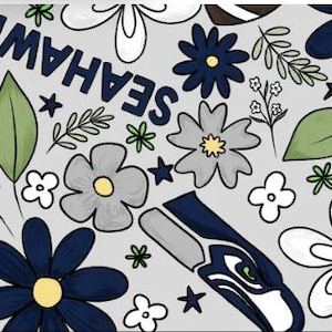May include: A light gray fabric pattern featuring the text SEAHAWKS in dark blue, interspersed with illustrations of dark blue, light gray, and white flowers, green leaves, small sprigs, tiny stars, and a stylized dark blue and gray bird logo.