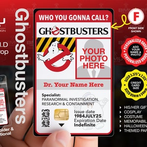 May include: A red and yellow Ghostbusters ID card prop with a photo placeholder, the text "Who You Gonna Call?" and "Ghostbusters", and a cartoon ghost. The card is 8.5 cm by 5.4 cm.