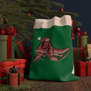 May include: A green Christmas gift bag with a white drawstring top. The bag features a red and white Santa hat wearing octopus illustration.