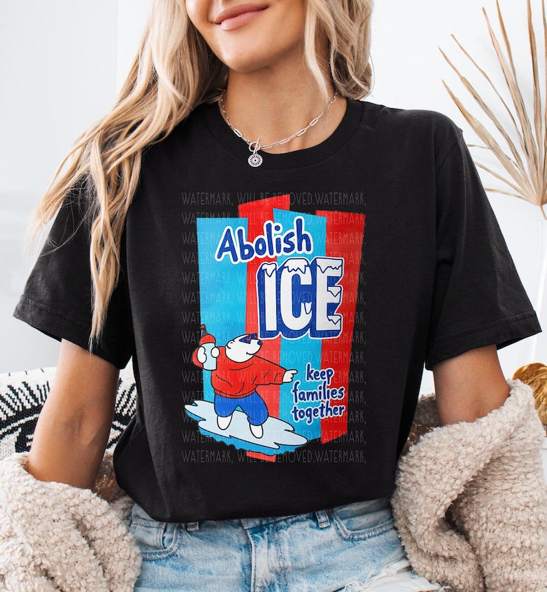 a woman wearing a black t - shirt with an ice advertisement on it