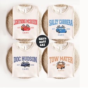 a set of four t - shirts with cars on them