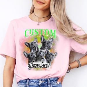 a woman wearing a pink shirt with three dogs on it