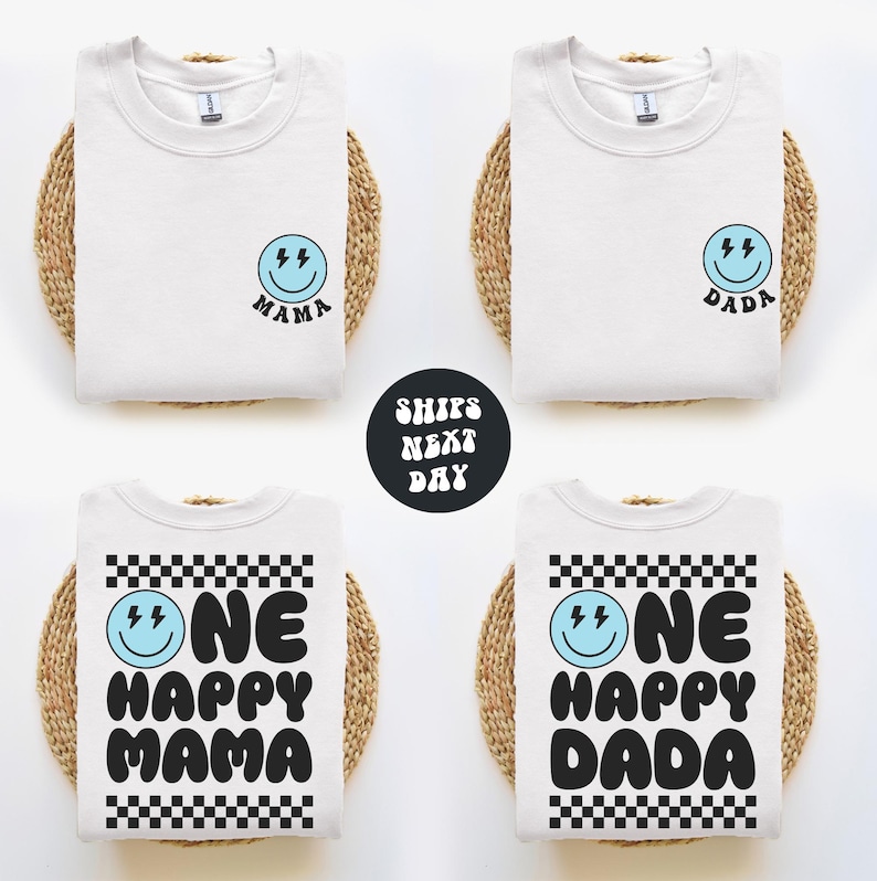 four white t-shirts with black text and a blue smiley face design, arranged in a grid pattern.