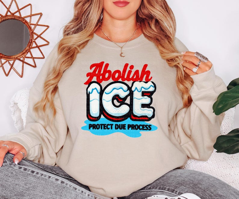 a woman wearing a sweatshirt that says abollish ice and protect due process