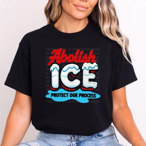 a woman wearing a black t - shirt with the words, abolah ice