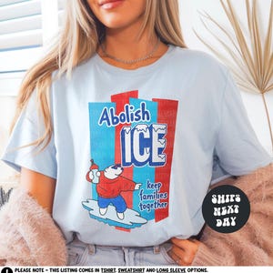 a woman wearing an ice t - shirt with a polar bear on it