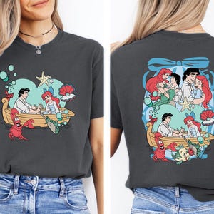 The image is a collage of two photos featuring a woman wearing a black t-shirt with a graphic design of characters from the Disney movie "The Little Mermaid".