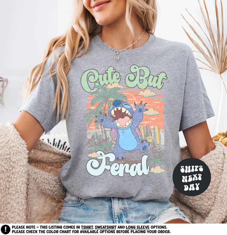 a woman sitting on a couch wearing a shirt with a cartoon character on it